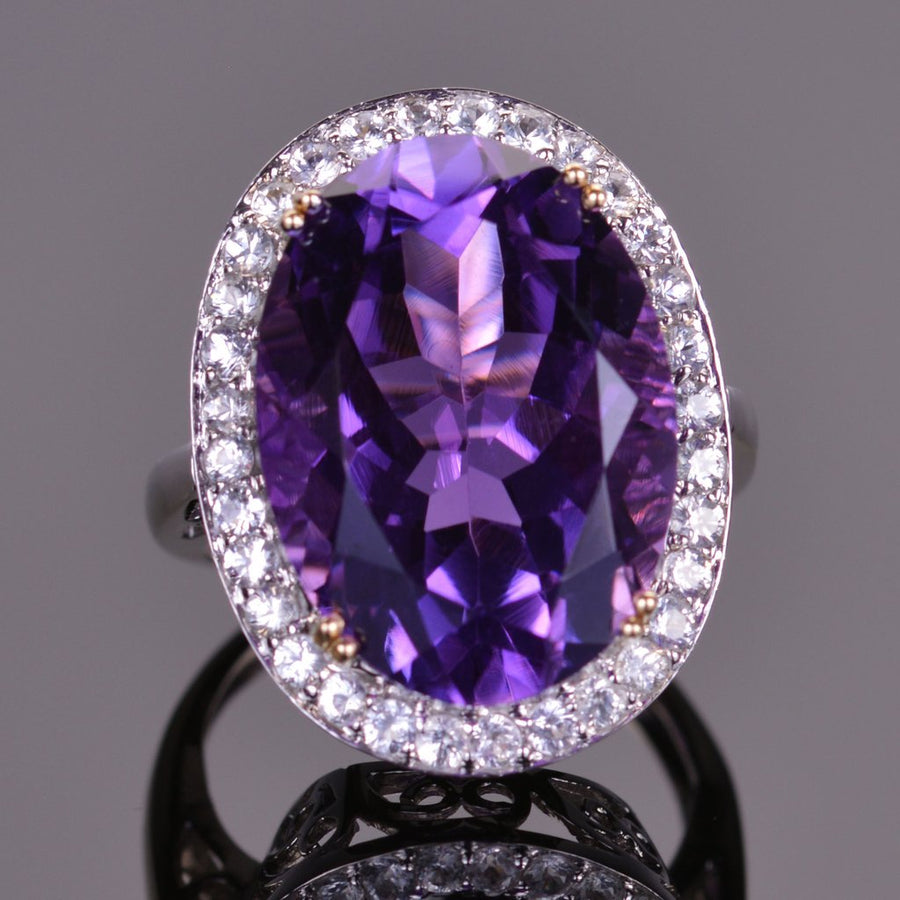 Oval amethyst ring with white sapphire halo in white gold