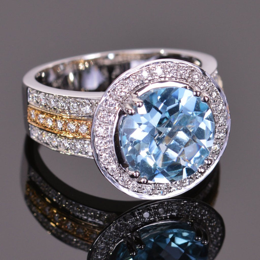 round blue topaz and diamond ring in yellow and white gold