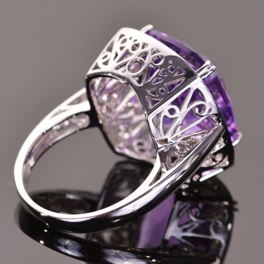 cushion amethyst ring with sapphire halo in white gold