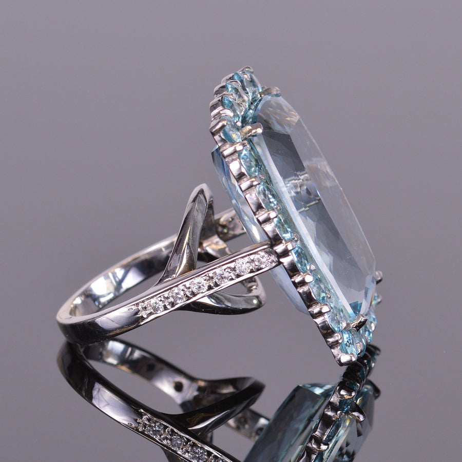 aquamarine ring with blue zircon halo in white gold
