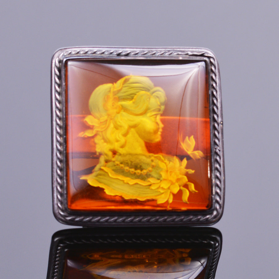 Hand carved amber cameo ring in sterling silver