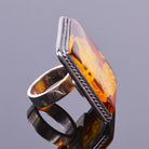 Hand carved amber cameo ring in sterling silver