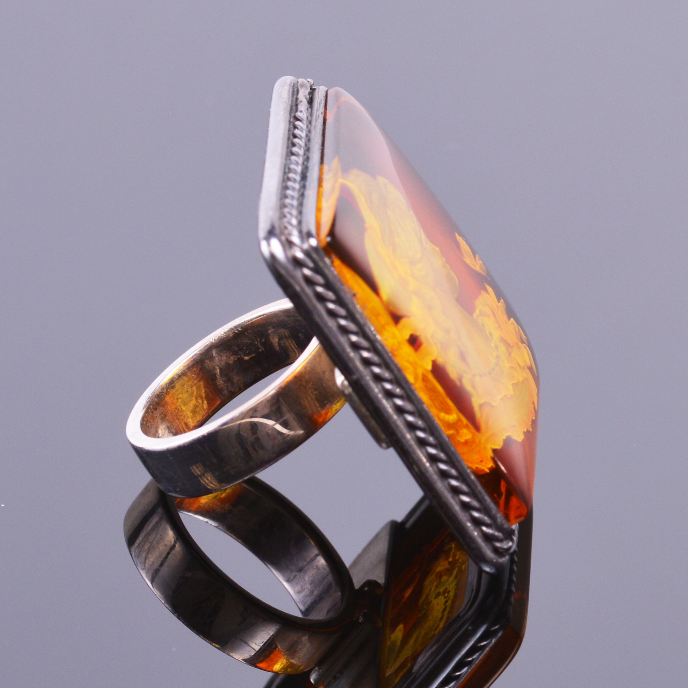 Hand carved amber cameo ring in sterling silver