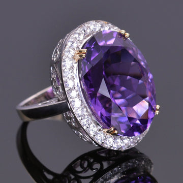 Oval amethyst ring with white sapphire halo in white gold