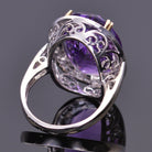 Oval amethyst ring with white sapphire halo in white gold