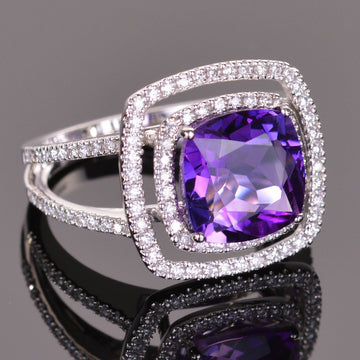 cushion amethyst ring with diamond double halo in white gold.