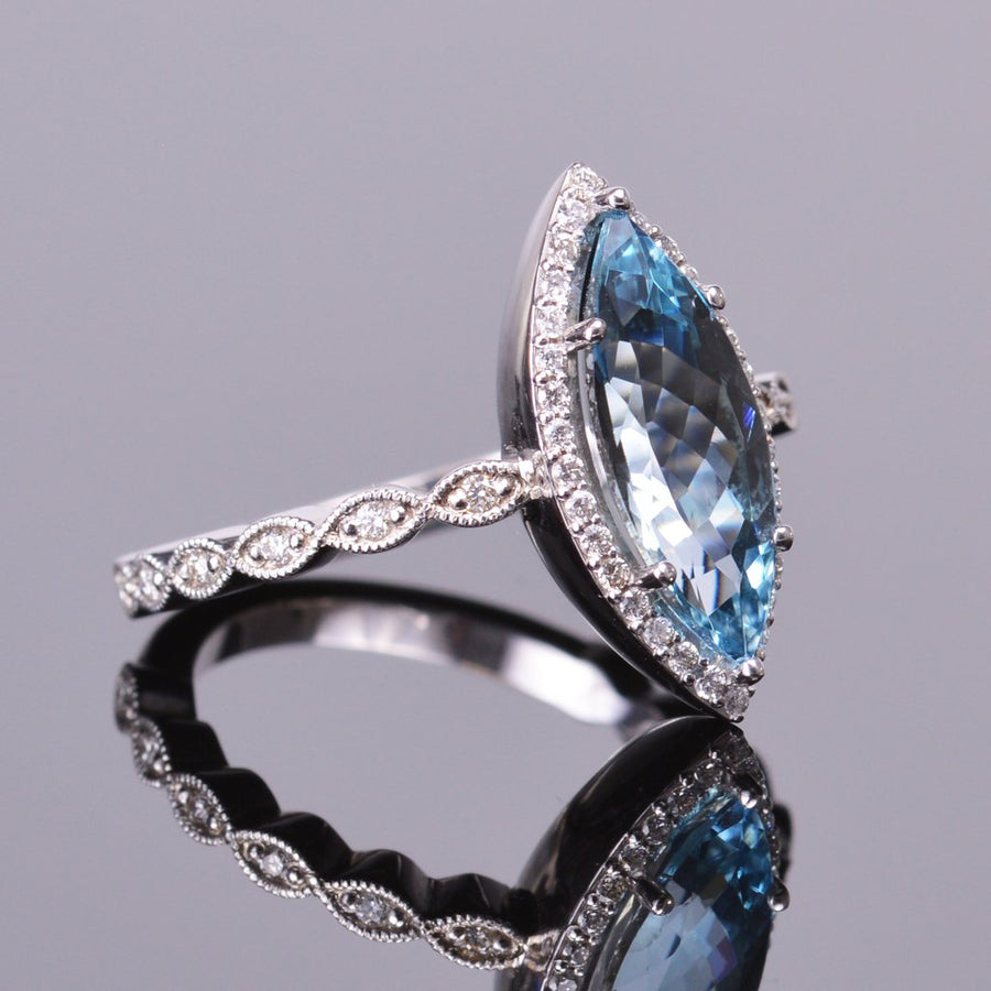 marquise aquamarine ring with diamond halo in white gold