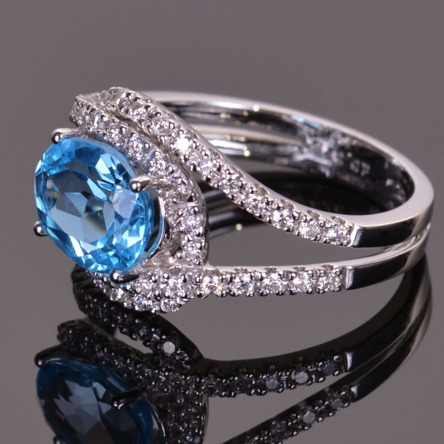 Blue Topaz and Diamond Infinity Ring in white gold