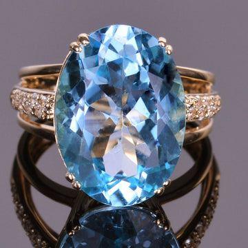 Blue Topaz and White Sapphire Oval Ring in Yellow Gold