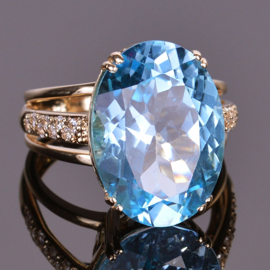 Blue Topaz and White Sapphire Oval Ring in Yellow Gold