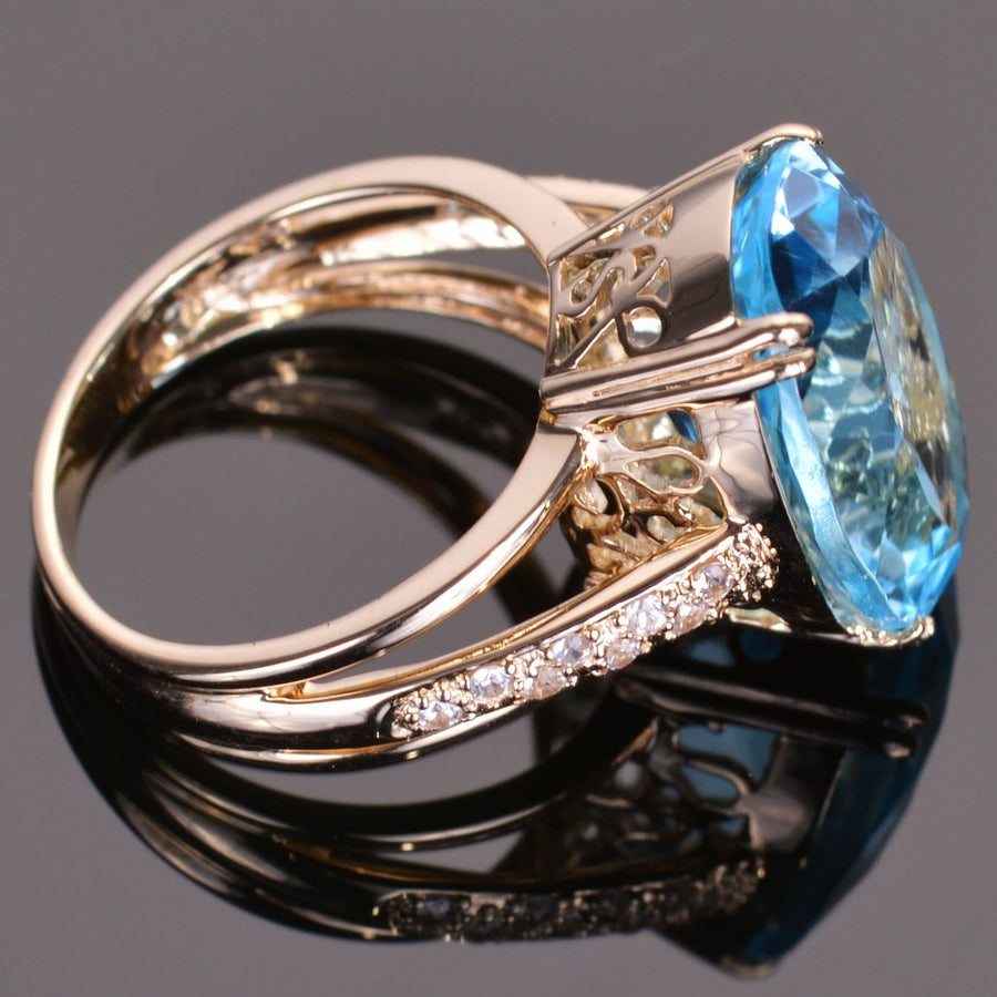 Blue Topaz and White Sapphire Oval Ring in Yellow Gold