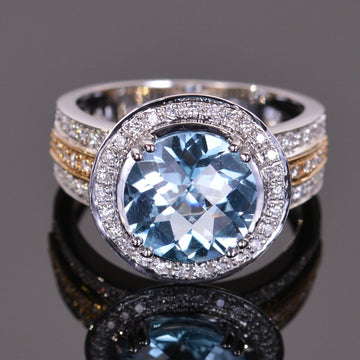 round blue topaz and diamond ring in yellow and white gold