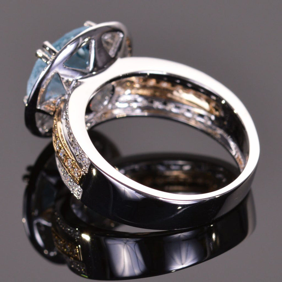 round blue topaz and diamond ring in yellow and white gold