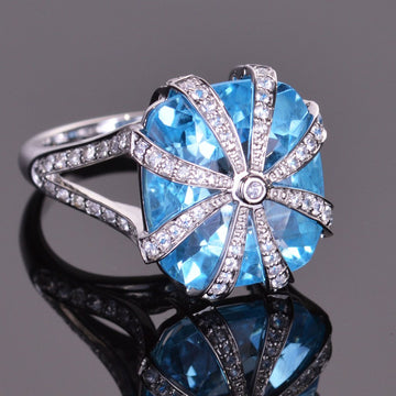 cushion blue topaz and white sapphire ring in white gold