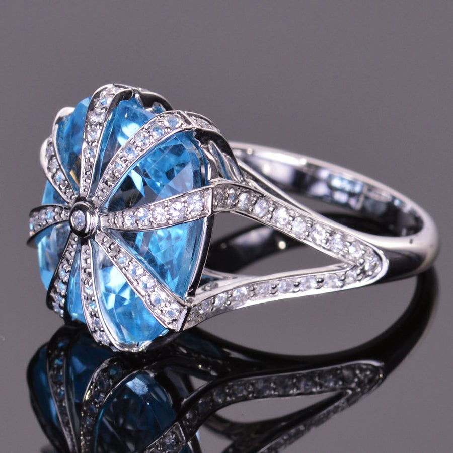 cushion blue topaz and white sapphire ring in white gold