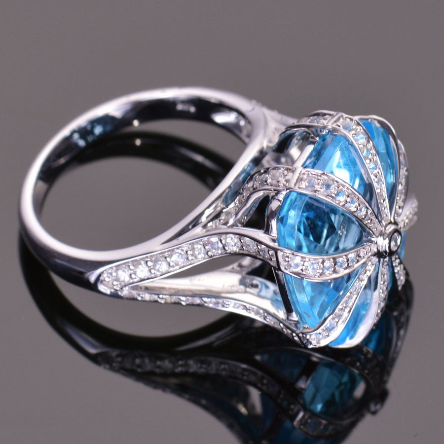 cushion blue topaz and white sapphire ring in white gold